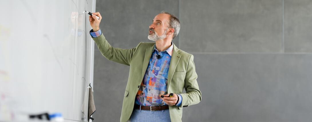 Acclaimed expert on digital transformation David Rogers, author of the best-selling The Digital Transformation Roadmap and academic director in Executive Education at Columbia Business School writing on the wall